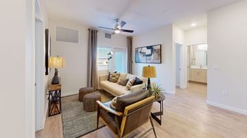 Albuquerque apartment for rent - A living room with a brown leather couch and a wooden coffee table.