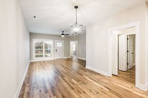 Bowling Green apartment for rent - A spacious room with wooden floors and white walls.