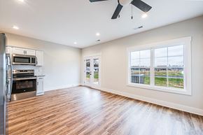 Bowling Green apartment for rent - A spacious kitchen with a refrigerator, oven, and microwave.