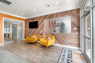 Fort Mill apartment for rent - A living room with a wood floor and a wall with a TV on it.