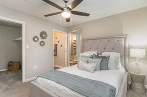 Pawleys Island apartment for rent - a bedroom with a bed and a ceiling fan at Litchfield Oaks Apartments, Pawleys Island, 29585