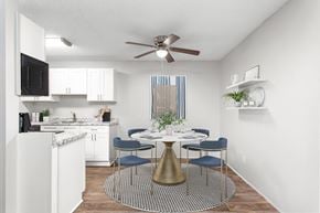 Greensboro apartment for rent - A kitchen with a dining table and chairs.