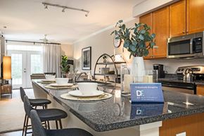 Chesapeake apartment for rent - A kitchen with a black counter top and a sign that says "Professionally Installed by DF Militant.".