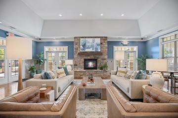 Clayton apartment for rent - A living room with two couches and a fireplace.