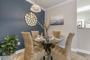 Raleigh apartment for rent - a dining room with a table and chairs