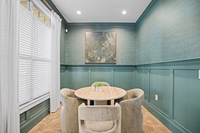 Clayton apartment for rent - A dining room with a round table and chairs.
