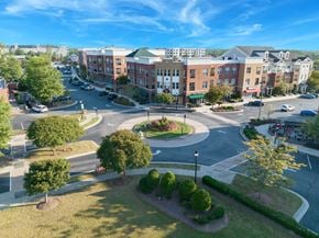 Morrisville apartment for rent - an aerial view of a parking lot with a street and buildings