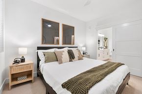 Delray Beach apartment for rent - a bedroom with a bed and two mirrors on the wall