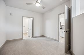 Raleigh apartment for rent - an empty bedroom with a closet and a door to a bathroom at The Falstaff, North Carolina