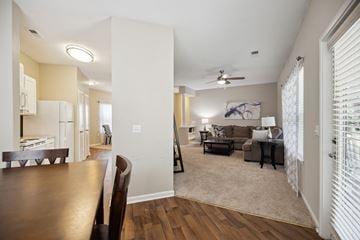 Raleigh apartment for rent - A living room with a brown table and a couch.