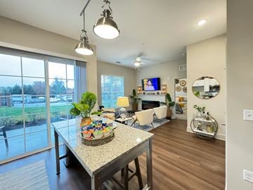 Glen Allen apartment for rent - A modern living room with a dining table and chairs.
