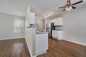 Columbus apartment for rent - A kitchen with white cabinets and a wooden floor.