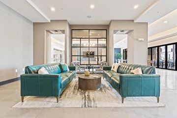 Wilmington apartment for rent - A living room with two green couches and a coffee table.