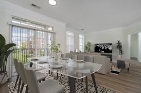 Hilliard apartment for rent - A modern dining room with a glass table and chairs.at Arlington Park, Ohio