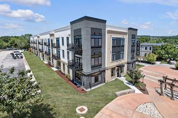 Newport News apartment for rent - A modern apartment complex with a mix of beige and dark grey buildings.