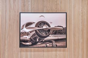 Newport News apartment for rent - A vintage airplane is displayed on a wall.