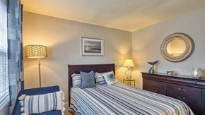 Norfolk apartment for rent - a bedroom with a bed and a chair