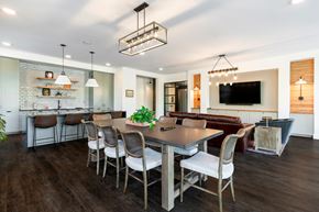 Frederick apartment for rent - A modern dining room with a large table and chairs.