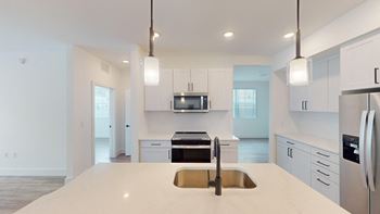 Under-mount sinks featuring gooseneck faucets
