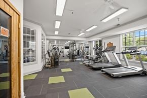 Raleigh apartment for rent - A gym with treadmills, weights and exercise machines.