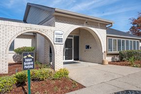 Antioch apartment for rent - a building with three arches and a sign in front of it