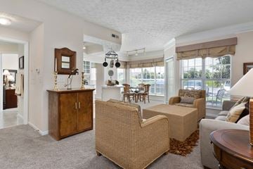 Columbus apartment for rent - A living room with a brown chair and a brown cabinet.