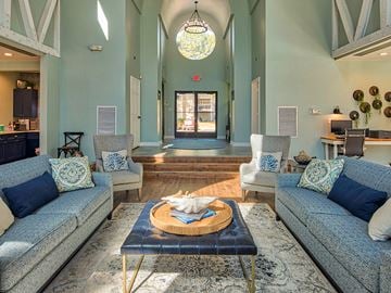 Newport News apartment for rent - A living room with a blue couch and a wooden coffee table.