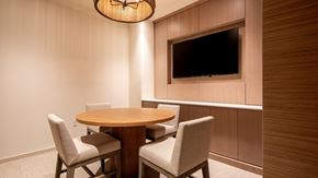 Virginia Beach apartment for rent - A modern dining room with a round table and chairs.