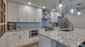 Chesapeake apartment for rent - a kitchen with white cabinets and granite counter tops