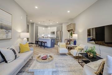 Cary apartment for rent - A living room with a grey couch and a rug.