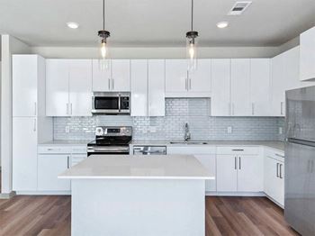 Chef inspired kitchen islands with designer lighting