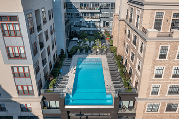 Rooftop pool with grilling, dining and lounge areas