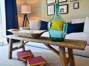 Coffee table and glass bottle