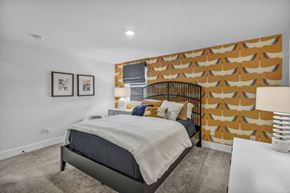 Dublin townhouse for rent - A bedroom with a bed, pillows, and pictures on the wall.