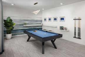 Norfolk apartment for rent - A pool table in a room with a painting on the wall at The Port at East Beach Apartments and Marina in Virginia, 23518