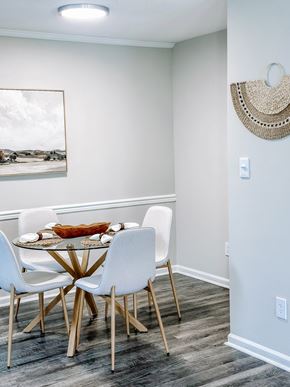 Hampton apartment for rent - A dining room with a white table and chairs.