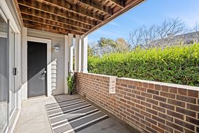 Charlotte apartment for rent - A house entrance with a striped rug on the ground.