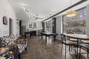 Raleigh apartment for rent - A room with a pool table and a couch.