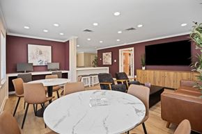 Raleigh apartment for rent - A modern dining room with a marble table and chairs.