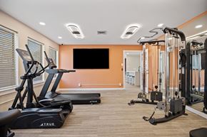 Raleigh apartment for rent - A gym with treadmills and exercise equipment.