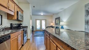 Lynchburg apartment for rent - A kitchen with wooden cabinets and granite countertops.