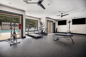 Raleigh apartment for rent - a home gym with a pool in the background