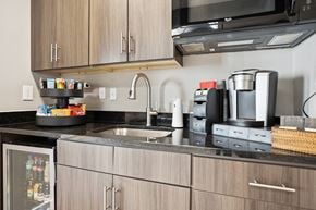 Charlotte apartment for rent - a kitchen with a sink and a coffee maker on the counter