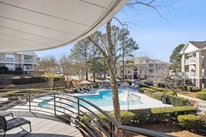 Charlotte apartment for rent - the preserve at ballantyne commons pool and patio area with apartment buildings