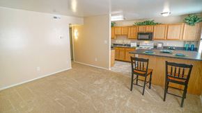 Newport News apartment for rent - A kitchen with a counter and two chairs.