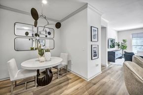 Columbus apartment for rent - A modern dining room with a white table and chairs.