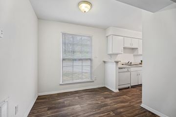 Raleigh apartment for rent - A room with a window and a kitchenette.