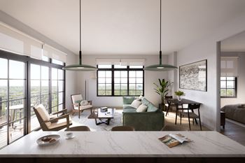 A modern living room with a large window and a view of the city.