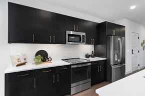 Columbus apartment for rent - a kitchen with black cabinets and white countertopsat Preston Centre, Ohio