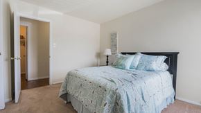 Virginia Beach apartment for rent - a bedroom with a bed and a door to a bathroom  at Bayville Apartments, Virginia, 23455